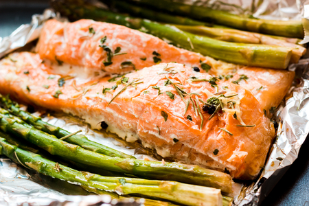 Salmon fillet cooked with asparagusの写真素材