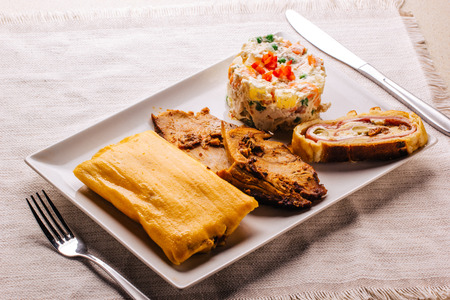 Christmas dish in Venezuela, hallaca, ham bread, salad and porkの写真素材