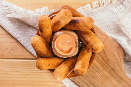Top view of Latin-American appetizers called TequeÃ±os made of fried corn filled with cheese with...