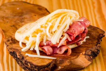 Delicious pre-cooked corn tortilla with cheese and baconの写真素材