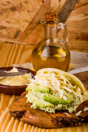 Typical Latin American food, arepa for breakfast with cheese, avocado and chickenの写真素材
