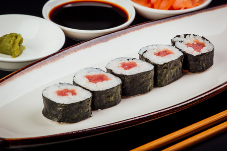 Tuna maki sushi rolls on a black background, japanese foodの写真素材