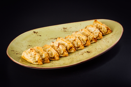 Group of delicious Japanese vegetable gyosas on a plateの写真素材