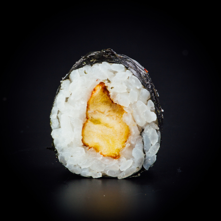 Fried plantain maki sushi rolls on a black background, japanese foodの写真素材