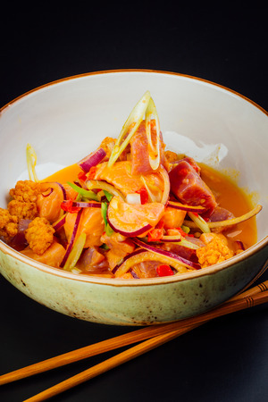 Bowl full of salmon and tuna ceviche, fusion of Peruvian and Japanese foodの写真素材