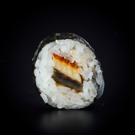 Eel maki sushi rolls on a black background, japanese foodの写真素材