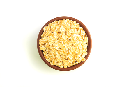 Top view of Bowl full of flaked oats on a white backgroundの写真素材