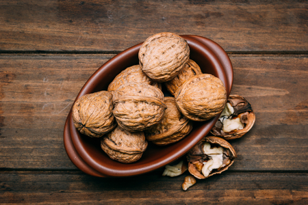 Walnuts on a wooden tableの写真素材