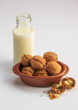 Walnuts milk on a white backgroundの写真素材