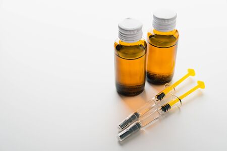 Coronavirus Vaccine, Corona virus Vaccine concept with syringe and
antidote on white background. Vaccine Concept of fight against coronavirus.の写真素材
