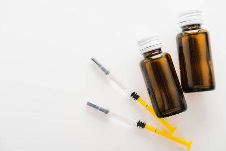 Coronavirus Vaccine, Corona virus Vaccine concept with syringe and
antidote on white background. Vaccine Concept of fight against coronavirus.の写真素材