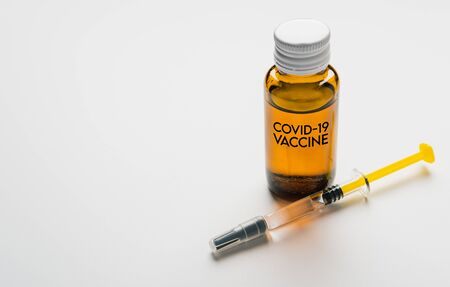 Coronavirus Vaccine, Corona virus Vaccine concept with syringe and
antidote on white background. Vaccine Concept of fight against coronavirus.の写真素材