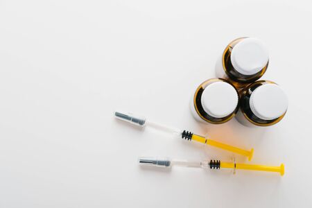 Coronavirus Vaccine, Corona virus Vaccine concept with syringe and
antidote on white background. Vaccine Concept of fight against coronavirus.の写真素材