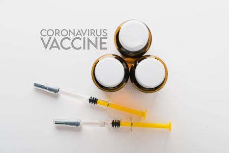 Coronavirus Vaccine, Corona virus Vaccine concept with syringe and
antidote on white background. Vaccine Concept of fight against coronavirus.の写真素材