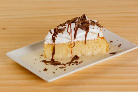Three milk cake with chocolate syrupの写真素材