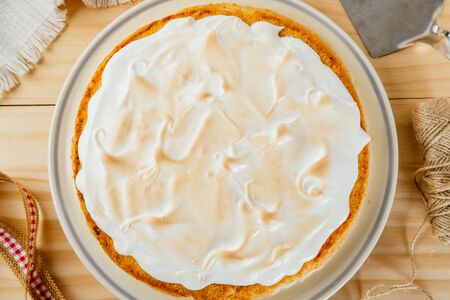 Top view of a delicious three milk cake on a pine wood background, typical Latin American dessertの写真素材