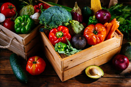 Fresh farm vegetables on a wooden table, balanced dietの写真素材