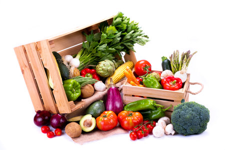 Boxes full of different types of healthy organic vegetables for a vegan dietの写真素材