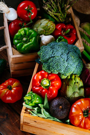 Top view of colorful fresh farm vegetables on a wooden table, balanced dietの写真素材