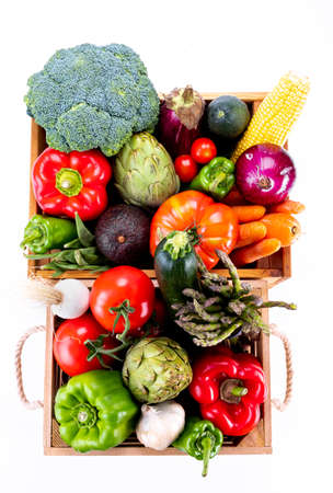 Top view of Healthy fresh vegetables in wooden boxes on white background, healthy foodの写真素材