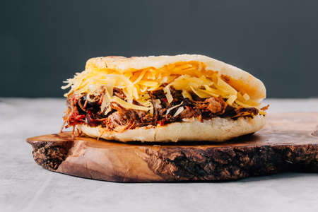 Delicious arepa of shredded meat with yellow cheeseの写真素材