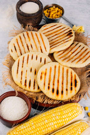 Top view of arepas, breakfast in Colombia and Venezuela, made with corn flourの写真素材