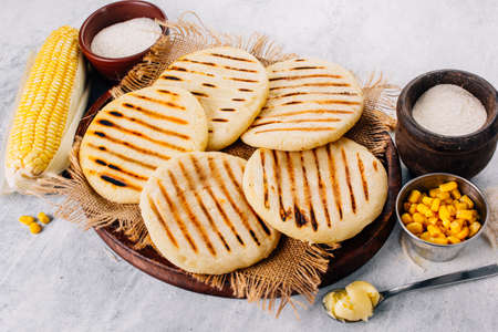 Top view of arepas, breakfast in Colombia and Venezuela, made with corn flourの写真素材