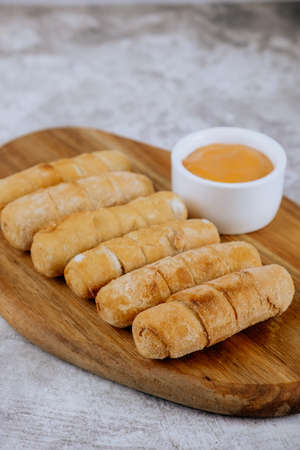 Fried tequeÃ±os, fingers stuffed with salty artisanal cheese, typical Venezuelan and Latin American foodの写真素材