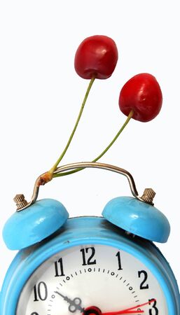 red cherries and vintage alarm clockの写真素材
