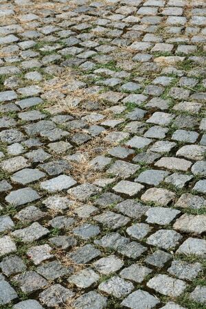 Old road paved with the cobble stonesの写真素材