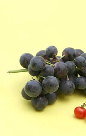 red grape on yellowの写真素材