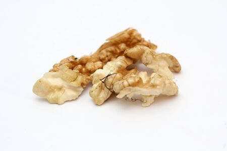 Crushed walnuts on white backgroundの写真素材