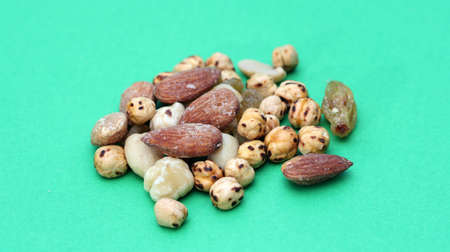 nuts on green backの写真素材