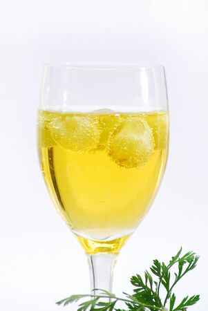 white wine with grapes in a glassの写真素材