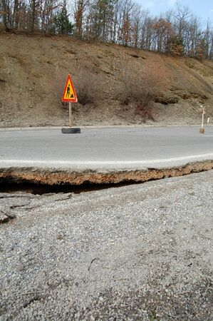 damaged road by floodsの写真素材