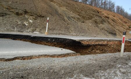 damaged road by floods