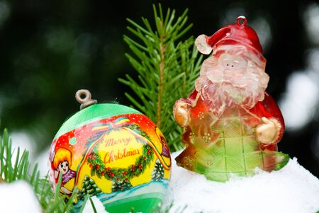 Christmass background, ball and santa  on snow and pine treeの写真素材