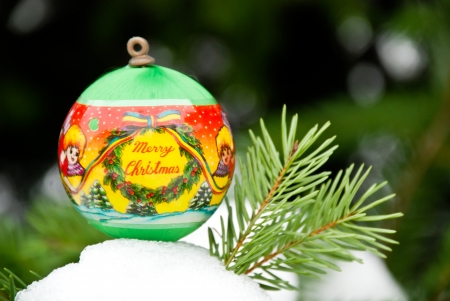Christmass background, balls on snow and pine treeの写真素材
