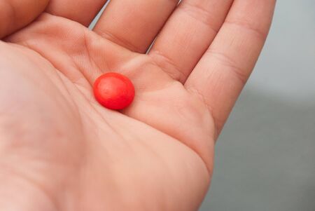 hand holding pillの写真素材