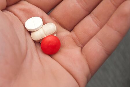 hand holding pillsの写真素材