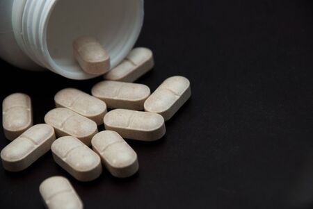  pills on black  backgroundの写真素材