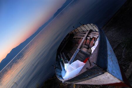 Boat on Lake Prespa , macedonia, on sunriseの写真素材