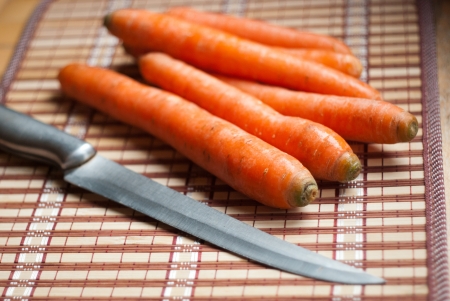 carrots and knife in the kitchenの写真素材