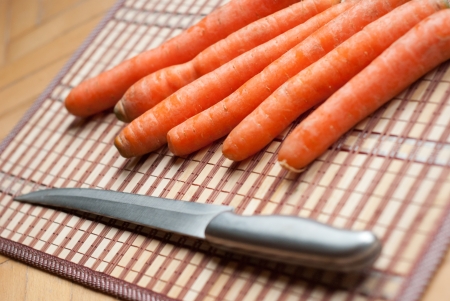 carrots and knife in the kitchenの写真素材