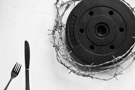 fork, knife and barbed wireの写真素材