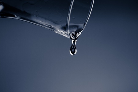 nice blue cocktail glass on blue  back の写真素材