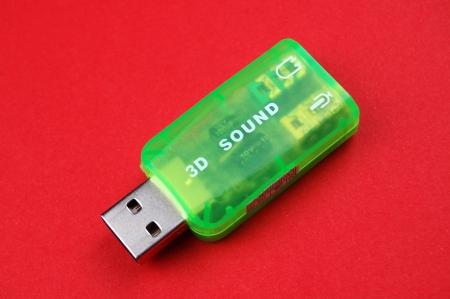  usb audio card on red backの写真素材