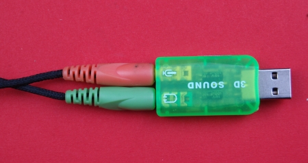  usb audio card on red backの写真素材