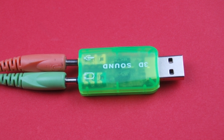  usb audio card on red backの写真素材
