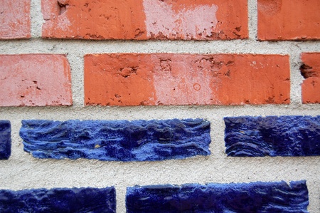 blue and red bricks on a wallの写真素材